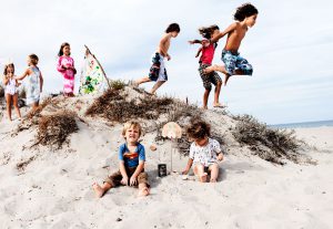 children having fun on the beach