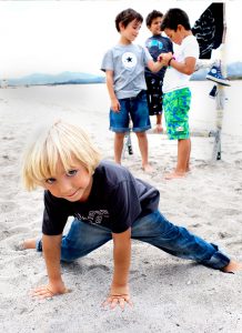 boy dancing on the beach
