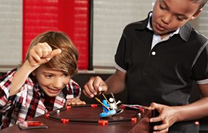 two boys playing lego