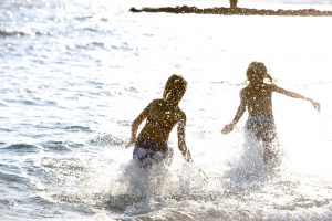 kids playing in the sea